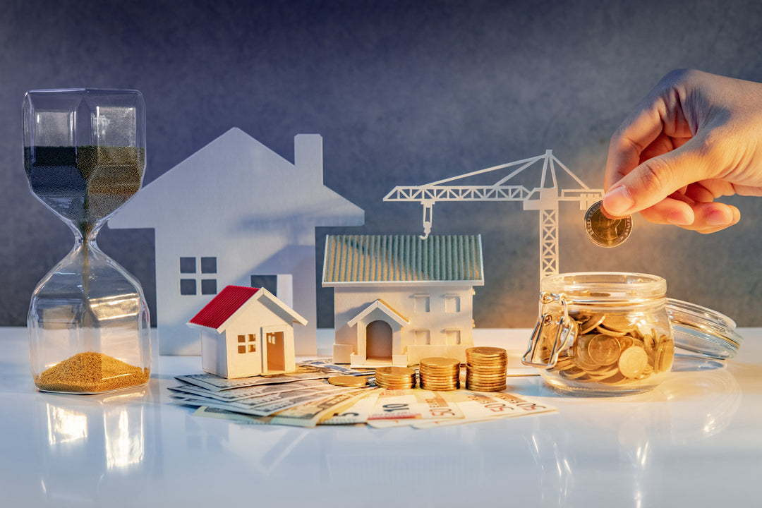 This image symbolizes real estate investment, savings, and financial growth, featuring houses, coins, money, and an hourglass.